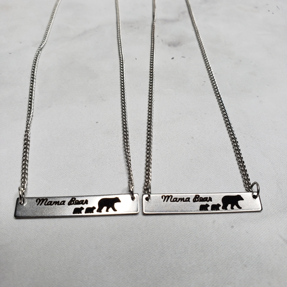 Mama bear silver colored necklace